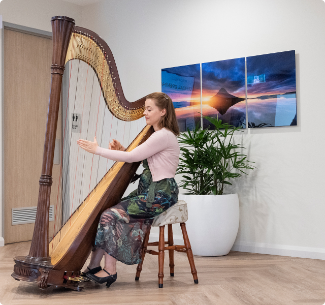 woman playing harp