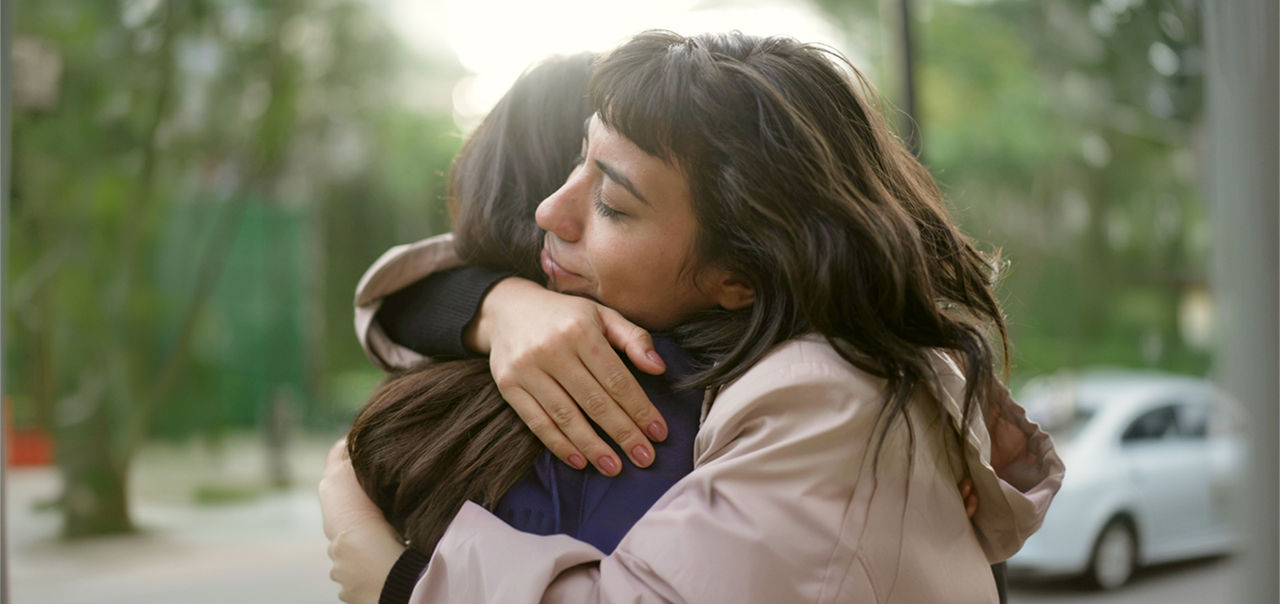 two friends hugging